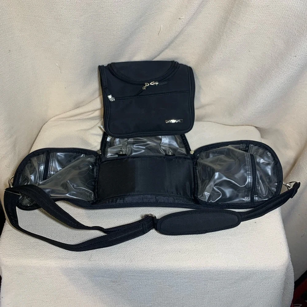 black travel bag for make up or toiletries